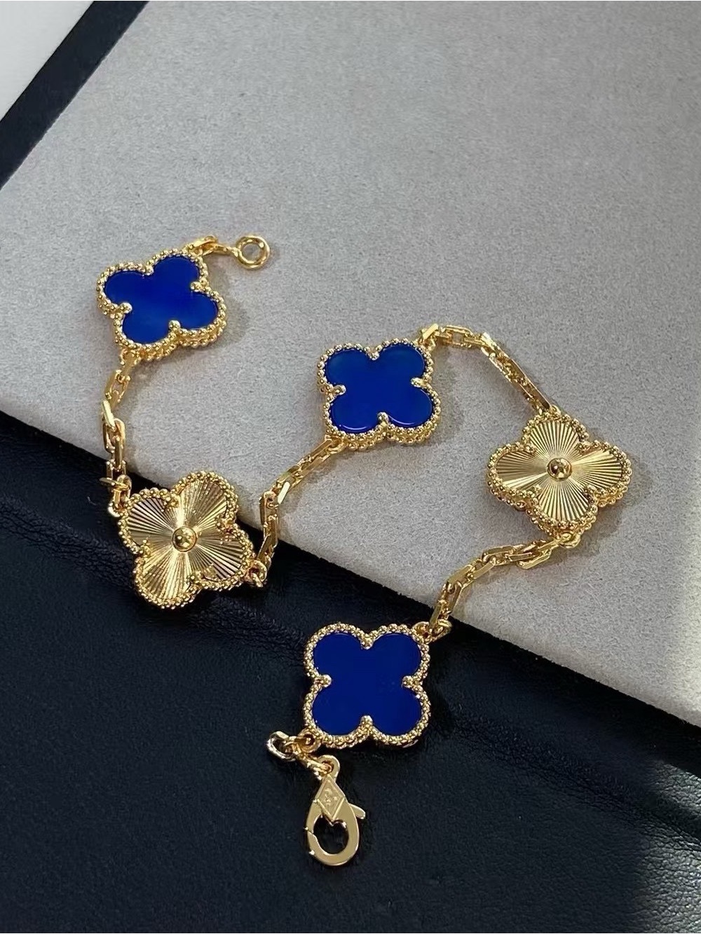 Van Cleef & Arpels Gold Bracelet with Royal Blue Clover Motifs